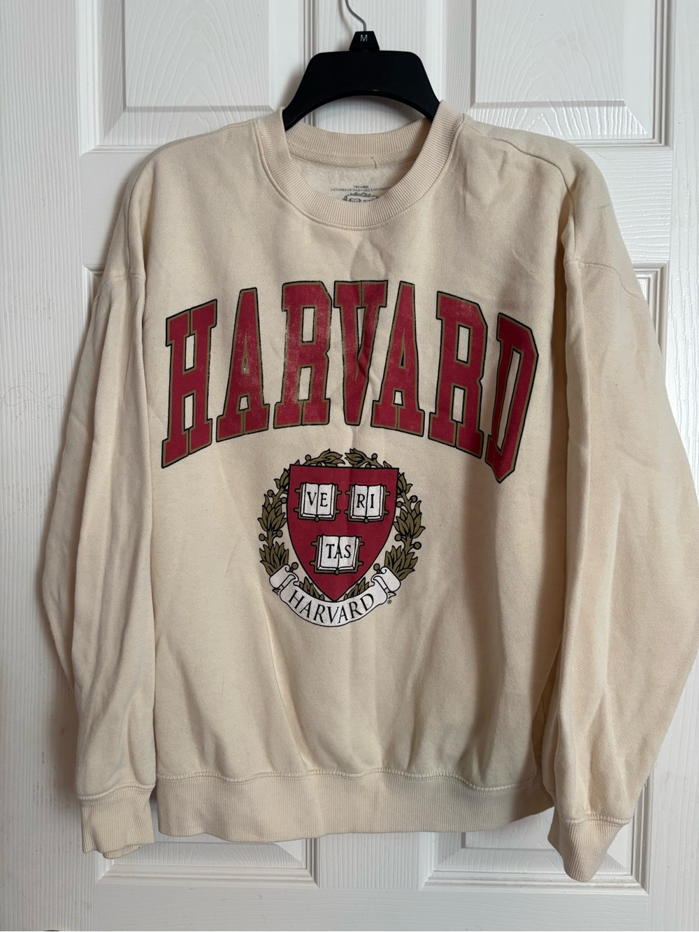 Cream Crewneck Sweatshirt with Red Crest